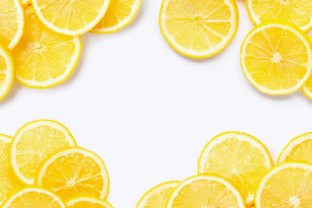 Frame made of fresh lemon with slices on white background. Copy spaceの写真素材