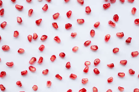 Pomegranate seeds on white background. Top viewの写真素材