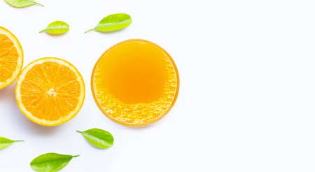 Glass of fresh orange juice on white background. Top view with copy space