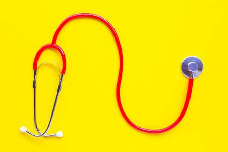 Stethoscope on yellow background with copy spaceの写真素材