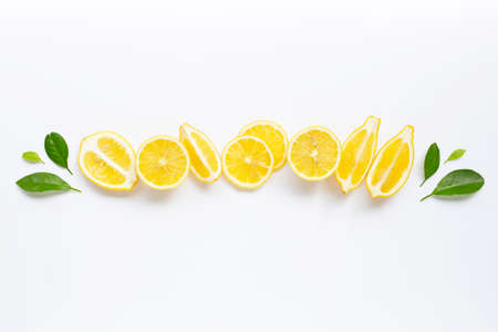 Fresh lemon with green leaves on white background.の写真素材