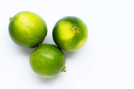 Fresh limes isolated on white background. Copy space