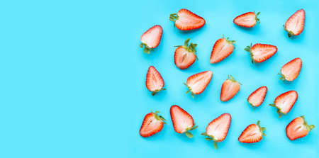 Ripe strawberries on blue background. Copy spaceの写真素材