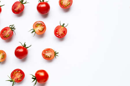 Fresh tomatoes, whole and half cut isolated on white background. Top viewの写真素材
