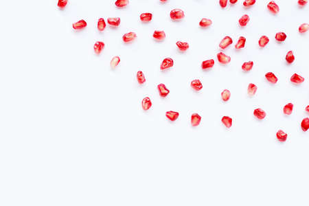 Pomegranate seeds on white background. Copy spaceの写真素材