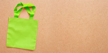Green bag  on plywood background.  Copy spaceの写真素材