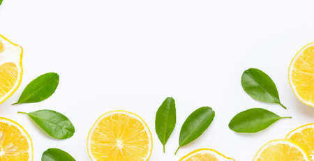 Frame made of fresh lemon and  slices with leaves isolated on white background.の写真素材