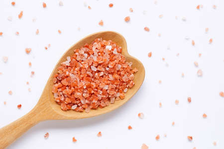 Pink himalayan salt on white background
