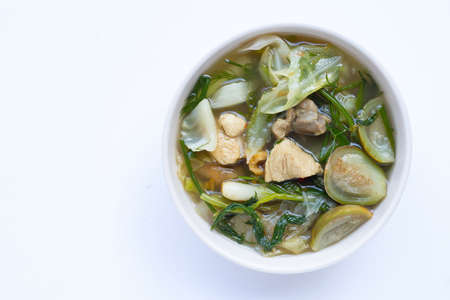 Thai northeast spicy soup, mixed vegetable with chicken  in bowl on white background.