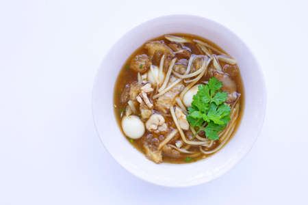 Braised fish maw in red gravy in bowl on white background.