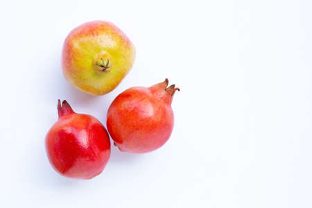 Top view of ripe pomegranate fruit on white background.の写真素材