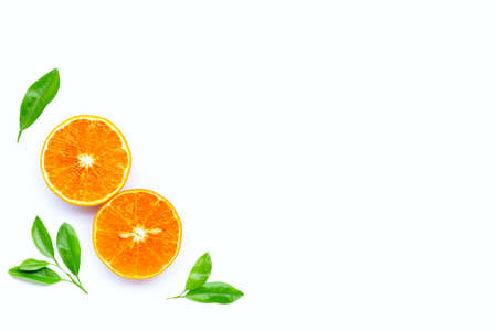 High vitamin C, Juicy orange fruit with leaves on white background. Copy space