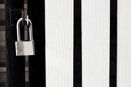 Padlock on a gate closeup.