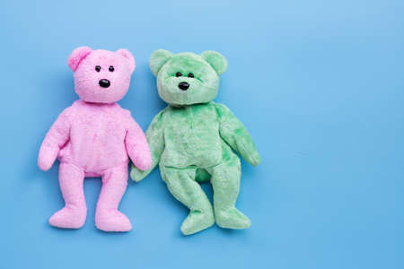 Bear toy couple on blue background. Copy spaceの写真素材