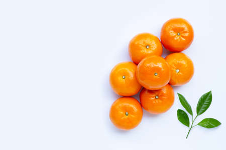 High vitamin C, Juicy orange fruit with leaves on white background. Copy spaceの写真素材