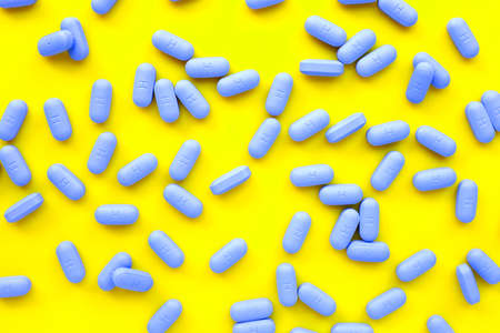 "PrEP" ( Pre-Exposure Prophylaxis) used to help protect people from HIV , yellow background.の写真素材