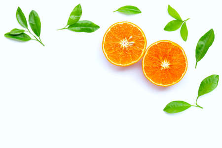High vitamin C, Juicy orange fruit with leaves on white background. Copy space