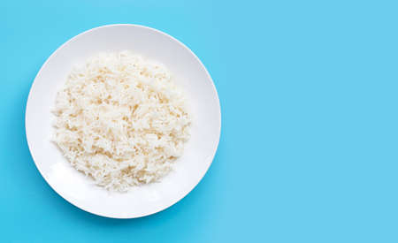 Dish of rice on blue background. Copy spaceの写真素材
