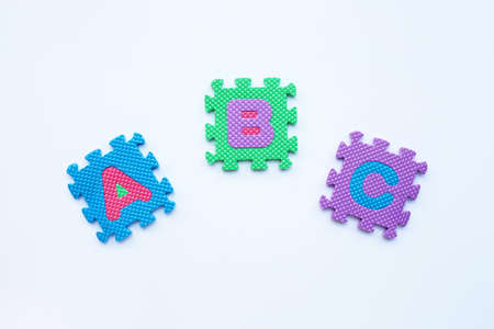 Colorful english alphabet puzzle on white background. Education concept, Copy spaceの写真素材
