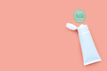 Alcohol hand sanitizer gel in white glossy plastic tube for hygiene corona virus (Covid-19) protection. Pink background with copy spaceの写真素材
