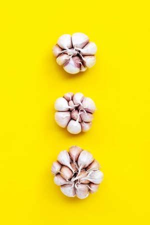 Cooking ingredients, Garlic on yellow background. Healthy eating conceptの写真素材