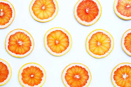 High vitamin C. Juicy grapefruit slices on white background. Top view