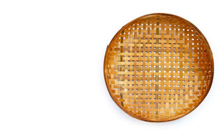 Wooden bamboo threshing basket on white background. Copy space