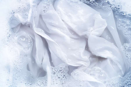 Top view of soak a cloth before washing, white clothの写真素材