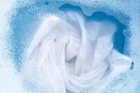 Top view of soak a cloth before washing, white cloth