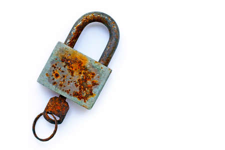Old rusty lock and key on white background. Copy spaceの写真素材