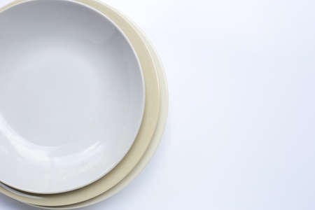 Top view of dishes on white background. Copy spaceの写真素材