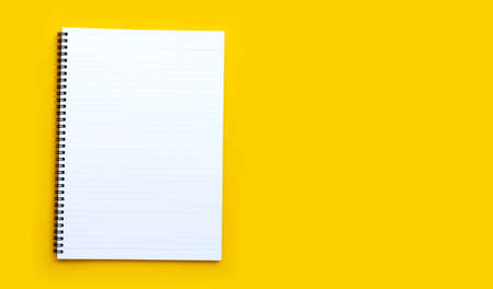 Diary on blue background. Top view with copy space