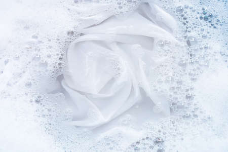 Top view of soak a cloth before washing, white cloth