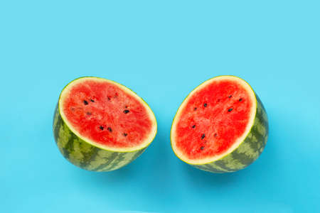 Fresh watermelon on blue background. Copy space