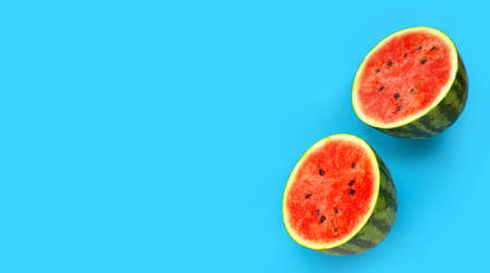 Fresh watermelon on blue background. Copy space