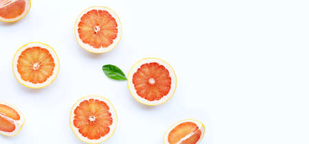 High vitamin C. Juicy grapefruit slices with leaf on white background. Copy spaceの写真素材