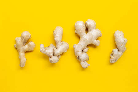 Ginger on yellow background.  Top view