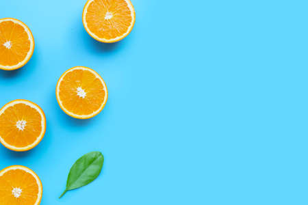 High vitamin C, Juicy and sweet. Fresh orange fruit  on blue background. Top view