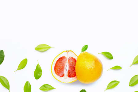 High vitamin C. Juicy grapefruit with leaves on white background. Copy spaceの写真素材