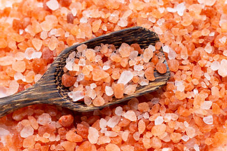 Top view of pink himalayan salt with wooden spoon