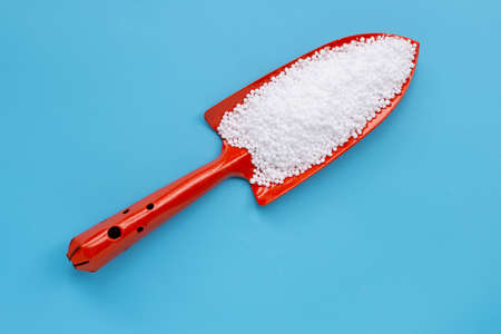 Chemical plant urea fertilizer on blue background. Copy spaceの写真素材
