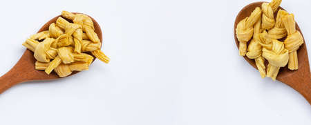 Dried bean curd knot on white background.
