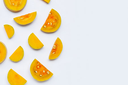 Butternut squash slices on white background. Copy spaceの写真素材