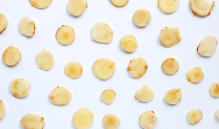 Fresh galangal  slices on white background. Top viewの写真素材