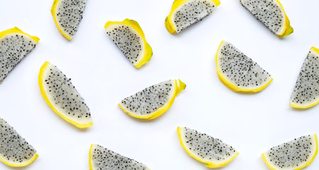 Yellow pitahaya or dragon fruit slices on white background. Copy spaceの写真素材