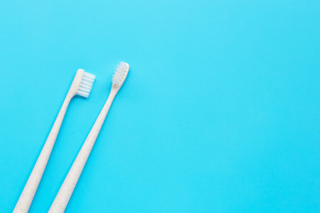 Toothbrush on blue background. Top viewの写真素材