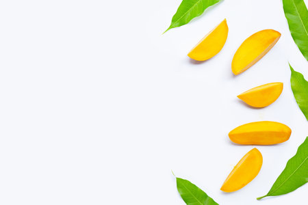 Tropical fruit, Mango  slices with leaves on white background. Top viewの写真素材
