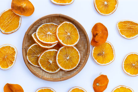 Dried orange slices on white background.の写真素材