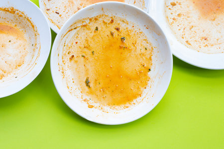 Dirty dishes on green background. Top viewの写真素材