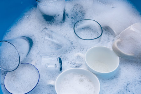 Washing used drinking glasses and cupsの写真素材